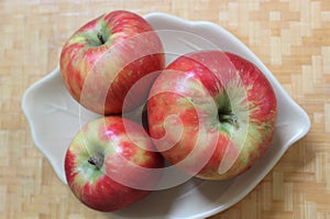 Honey crisp apples on a wooden table