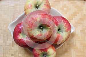 Honey crisp apples on a wooden table