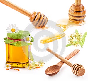 Honey dipper and Honey in glass jar with flowers