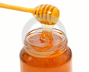 Honey dripper and Honey jar isolated photo