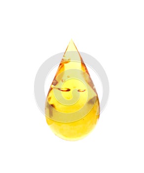 Honey dripping in glass jar and wooden dipper isolated on a white background, concept of bee products.