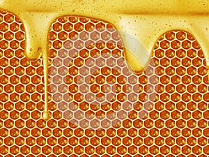 Honey dripping on honeycomb background
