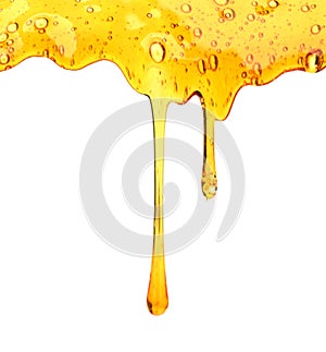 Honey dripping from wooden honey dipper