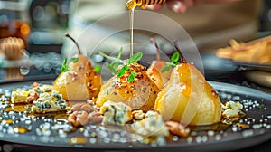 Honey drizzles over poached pears with cheese and nuts on a black plate, with a chef in the background