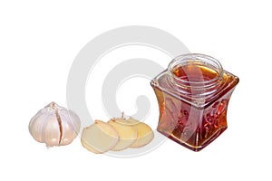 Honey , ginger and garlic on white background