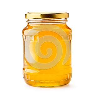 Honey in a glass jar close-up on a white. Isolated.