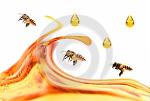 Honey in a glass jar with flowers on the wooden floor.