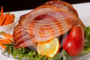 Honey glazed Easter ham with fruit and carrots