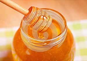 Honey on honeycomb background