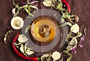 Honey with honeycomb in a glass bowl,
