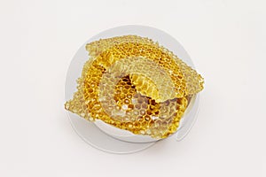 Honey and honeycombs isolated on white background