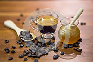 Honey jar and coffee cup and coffee beans