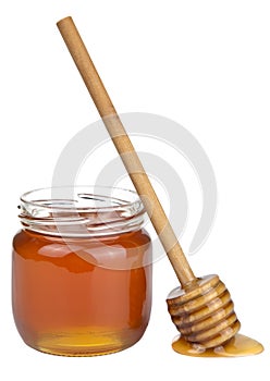 Honey in jar and dipper isolated