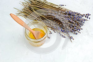 honey jar and dry lavender flowers