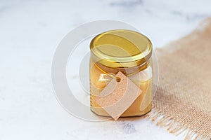 Honey in jar with empty paper label for your text