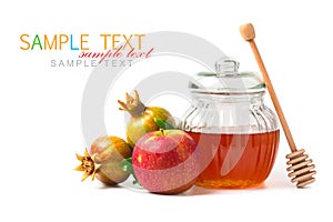 Honey jar and fresh apples with pomegranate on white background