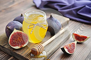 Honey in jar with honey dipper