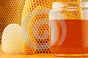 Honey in jar with honeycomb