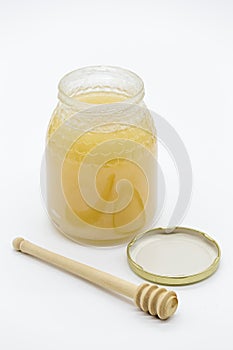 Honey jar and wooden honey spoon