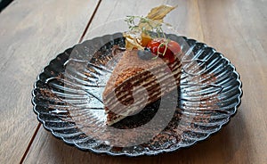 honey layer piece of cake on decorative plate to serve in cafe