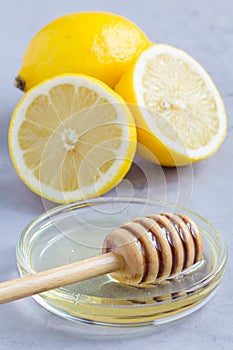 Honey and lemon: cold, flu remedy, concrete background