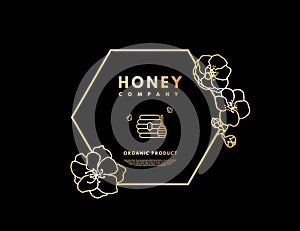 Honey logo with gold gradient honeybee, beehive and honey stick in frame hexagon with flower. Label banner for company