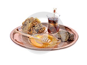 Honey on plate ,cup of Turkish tea