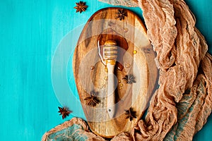 Honey with special spoon on a chopping board