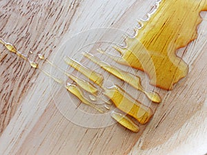 honey splash on the wooden table photo