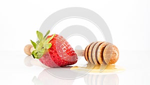 Honey on stick with strawberry