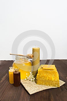 Honey still life with liquid honey and beeswax