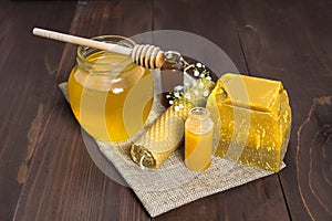 Honey still life with liquid honey and beeswax