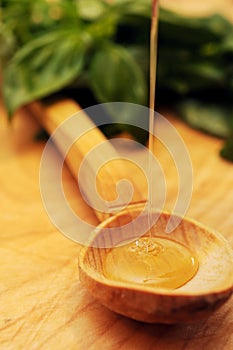 Honey streaming into spoon