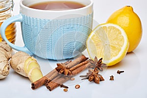 Honey and tea with spices and lemon.