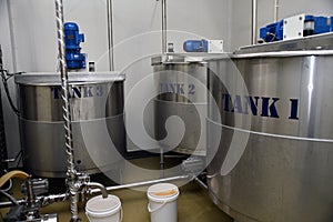 Honey vats at a processing plant photo