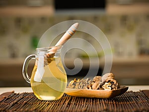 Honey and wallnuts on kitchen table