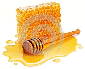 Honey wooden dipper (stick) in plash of honey with honey comb on a white background. photo