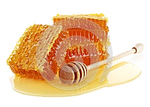 Honeycomb with honey dipper isolated on white background. Organic natural ingredients