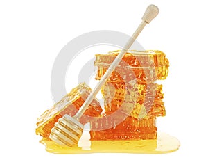 Honeycomb and honey dipper isolated on white background. Yellow honeycomb slices