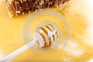 Honeycomb with honey and honey stick