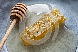 Honeycomb with honey spoon