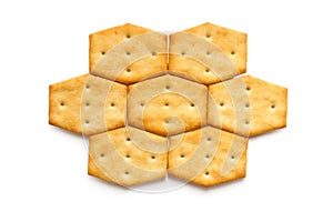 Honeycomb pattern of crackers on white background.