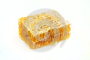 Honeycomb piece. Honey slice isolated on white background. design element. Fresh honeycomb close-up macro photo