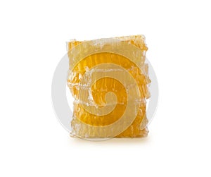 Honeycomb piece. Honey slice isolated on white background. Yellow Honeycomb slice closeup isolated on white. Honey cell slice isol