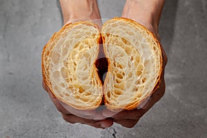 Honeycomb in sliced croissant according to the number of folds on cement background. photo