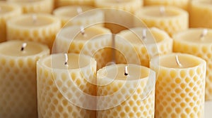 Honeycomb textured beeswax candles in row with soft lighting photo
