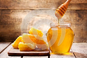 Honeycombs and jar of honey