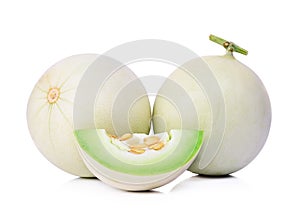 Honeydew melon sliced in half isolated on white