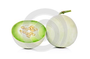 Honeydew melon sliced in half isolated on white