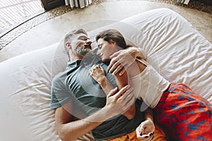 Honeymoon couple relaxing in a hotel room